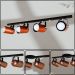 Trilho de 65cm com 04 Spots para 04 lâmpadas padrão E27 - Ideal para Sala, Quarto, Cozinha, Comércio - Bivolt 110v/220v - Preto com Cobre